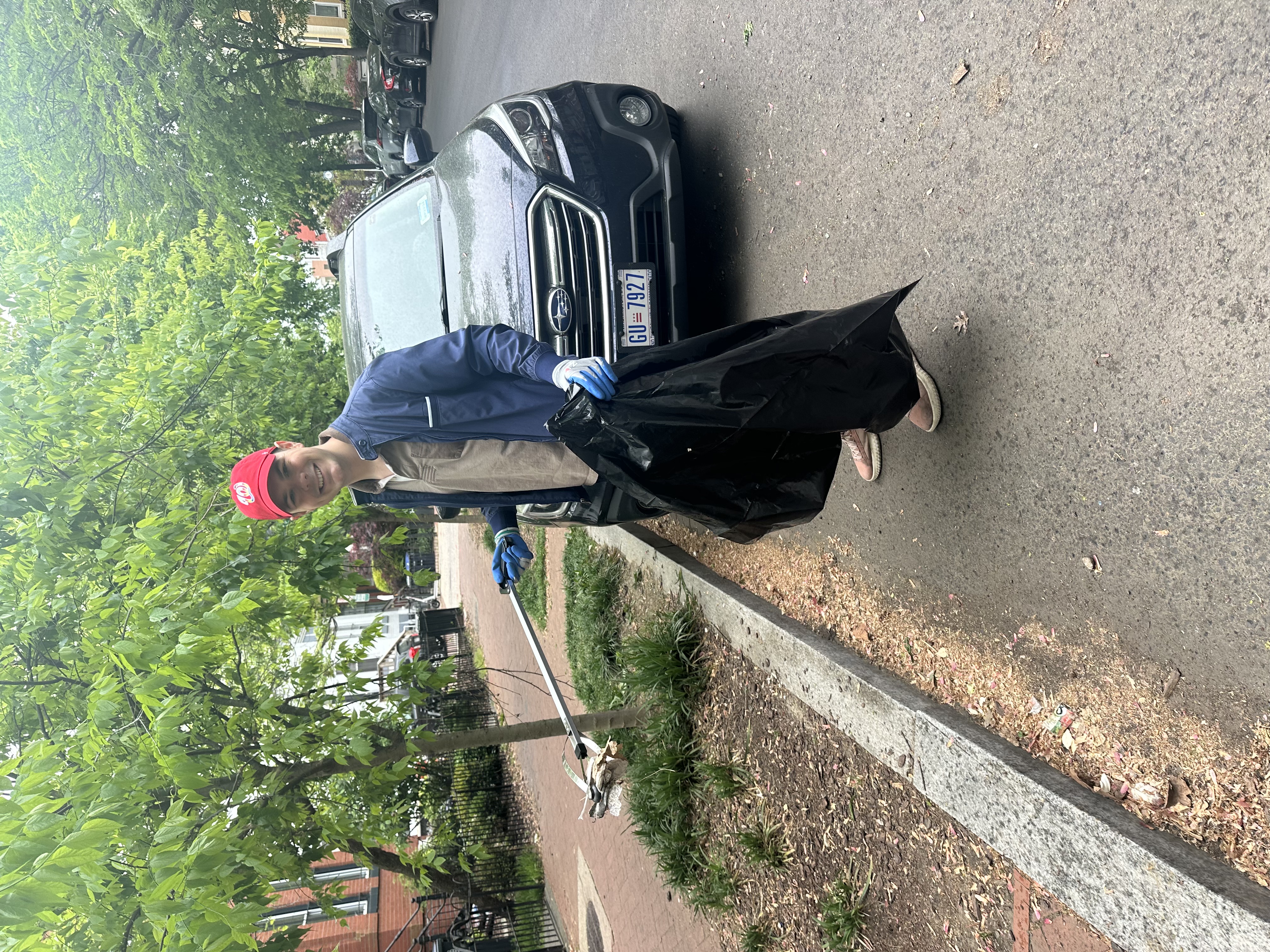 Steven picking up litter at a neighborhood clean-up